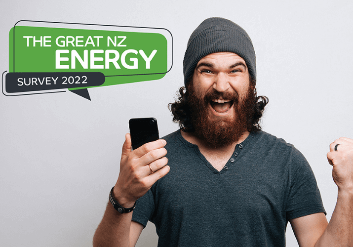 Man holding a phone in one hand, looking excited. Great energy survey logo to the left hand side